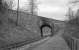 Old undated photograph looking along the Peebles Loop towards Clovenfords at Balnakeil, showing the highly skewed arch (Bridge No. 65) that carried the A72 road over the Peebles branch on the western outskirts of Galashiels. If this view was still possible today (2014), Bruce Motors garage would be visible through the bridge.<br><br>[Bill Jamieson Collection //]
