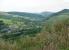 Looking Southwest down the Afan Valley in August 2002 with the trackbed of the Rhonnda and Swansea Bay line curving between the road and the river.<br><br>[John Thorn 06/08/2002]