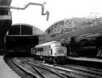 Peak 175 recently arrived at Newcastle Central with a northbound train in September 1969 - receiving strange looks from the water column!<br><br>[John Furnevel 30/09/1969]