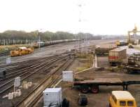 View west in 1972 over the area once occupied by a section of the extensive Portobello yard. A class 37 is approaching with a Granton - Grangemouth oil train on the main line while a type 2 is waiting for container loading to be completed in the Freightliner terminal. Part of the area to the left and rear of the camera is also in use as a PW depot.<br><br>[John Furnevel 22/09/1972]