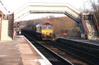 Longannet coal empties passing south through Cumbernauld station on their way back to Hunterston in February 2005 behind EWS 66102.<br><br>[John Furnevel 26/02/2005]