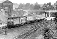 A pair of EE class 50 locomotives with train 1S57, the diverted down <I>Royal Scot</I>, heading north through Dumfries on Saturday 3 June 1972 during electrification work on the WCML. The large wooden sign on the old goods depot top left still reads <I>Caledonian Railway Goods Station</I>.<br><br>[John Furnevel 03/06/1972]