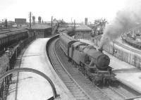 A busy scene looking north over Rutherglen station on 4 August 1955. A Maryhill - Hamilton train  is about to restart, hauled by Hamilton West's Fairburn 2-6-4T no 42167.<br>
   <br><br>[G H Robin collection by courtesy of the Mitchell Library, Glasgow 04/08/1955]