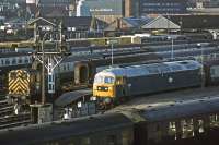 There's plenty of stock on hand at Norwich on 9th December 1978. 47130 is preparing to head for London Liverpool street and 03086 is engaged on carriage marshalling duty. A Cravens DMU is stabled in the foreground.<br><br>[Mark Dufton 09/12/1978]