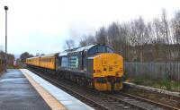 DRS 37425 is the motive power at the rear of the Network Rail test train departing Muir of Ord for Inverness on 28 January 2015. [See image 50166] <br><br>[John Gray 28/01/2015]
