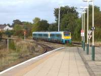An Arriva Trains Wales 175/1 leads a 175/0 north out of Wrexham General late in the afternoon on 1 October 2012. The Wrexham - Bidston line through platform 4 is on the far left [see image 11054].  <br><br>[David Pesterfield 01/10/2012]