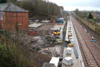 Ongoing work at Newtongrange, looking south on a wet 16 March 2015. The car park is starting to take shape on the left with work also underway on the direct link to the National Mining Museum at the far end of the platform.<br><br>[John Furnevel 16/03/2015]