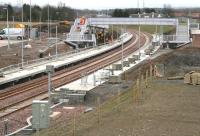 Work continuing at the new Shawfair station on 27 March 2015 with the footbridge the centre of activity on this occasion. View south towards Sheriffhall. <br><br>[John Furnevel 27/03/2015]