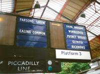 When I photographed these fine old platform indicators at Earls Court in 1994 I wouldn't have believed that they would still be there 21 years later. In fact the left-hand column has been supplemented with a 'STOPS HERE' at the bottom.  Inflexible, but simple and effective.<br>
<br>
<br><br>[David Panton 14/07/1994]