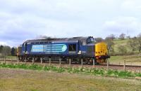 37425 comes off the curve west of Beauly on a route learning trip to Wick on 13 April 2015.<br><br>[John Gray 13/04/2015]