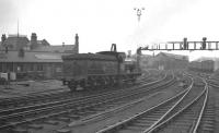 Well turned out J21 0-6-0 65033 takes the goods lines past Newcastle Central heading for the King Edward Bridge early one grey Saturday morning in May 1960. The 1889 locomotive was on its way from Heaton to Darlington where it would take charge of the SLS/SDLS <i>J21 Rail Tour</i> to Carlisle via Stainmore. [See image 36451]<br><br>[K A Gray 07/05/1960]