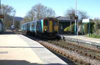 Having paused at the signalbox to exchange tokens, the 1653 Llandudno - Blaenau Ffestiniog carries on through North Llanrwst station on 14th April 2015 without being requested to stop.<br><br>[Colin McDonald 14/04/2015]