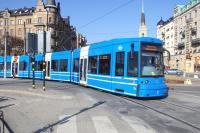 A Number 7 tram, a Flexity Swift A32, turns from Strandvagen on to Djurgardsbron in Stockholm on 16 March 2015. <br><br>[Colin Miller 16/03/2015]