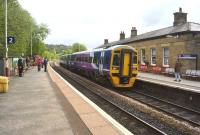 Northern 158816 on a westbound Calder Valley service calls at Todmorden on 17 May 2015.<br><br>[John McIntyre 17/05/2015]