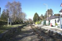 Late afternoon sunshine at Tal-y-Cafn on 14th April 2015. The board on the retained but disused up platform still displays the full former name of Tal-y-Cafn & Eglwsbach.<br><br>[Colin McDonald 14/04/2015]