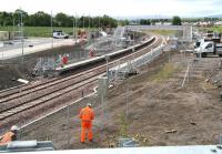 Activity at Shawfair station on 3 June 2015 centres around fencing and platform 'furniture'. View south towards Sheriffhall.<br><br>[John Furnevel 03/06/2015]