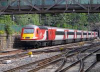 Virgin Rail East Coast-liveried HST forms the 07.55 Aberdeen - London Kings Cross service, approaching The Mound tunnel in Princes Street Gardens on 23 June.<br><br>[Bill Roberton 23/06/2015]