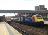Thirty years of progress in DMU's at Leicester in June 2015 - hopefully more evident under the skin than on the outside! The Meridian on the left is heading for London; the HST on the right - still a treat to ride in, despite the occasional strange smells - is bound for the East Midlands.<br><br>[Ken Strachan 19/06/2015]