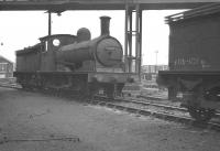 J25 0-6-0 65691, standing below the footbridge linking Darlington steam shed with the DMU depot on the west side of the main line. Thought to have been photographed in the autumn of 1961, between withdrawal from North Blyth in October and cutting up in the nearby works during November.<br><br>[K A Gray //1961]