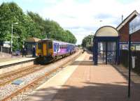 Don't always believe what it says on the destination blind! View of Adlington station looking south towards Blackrod on 17 July 2015. The service is not going where the blind is displaying (Blackpool North) but towards Manchester Victoria.<br><br>[John McIntyre 17/07/2015]