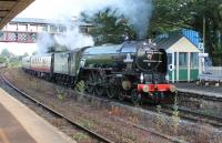 60163 <I>Tornado</I> lifts the returning <I>Torbay Express</I> through Torre station in the Torquay suburbs on its way from Kingswear to Bristol on 26th July 2015. <br><br>[Mark Bartlett 26/07/2015]