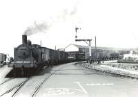 Shunting at Ardrossan Winton Pier on a sunny 6 July 1959 is McIntosh 3F 0-6-0T 56282. The 1898 veteran survived until April 1962 at the nearby Ardrossan shed.  <br><br>[G H Robin collection by courtesy of the Mitchell Library, Glasgow 06/07/1959]