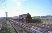 Corkerhill Standard Class 5 4-6-0 no 73122 passing over Stawfrank troughs with an up relief WCML service on 17 July 1965. <br><br>[John Robin 17/07/1965]