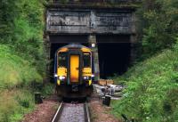 156449 on an Anniesland - Queen Street service emerges from the tunnel under the Forth and Clyde Canal on 23rd September 2015. Parts for the junction pointwork can be seen awaiting installation at the other end of the tunnel.<br><br>[Colin McDonald 23/09/2015]