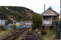 The disused Pwllheli West box still survives along with a short section of double track approaching the station, which formerly had an island platform with loco release roads.<br><br>[Colin McDonald 14/10/2015]