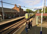 The 1655 train to Ayr coasts into Johnstone station on 14th July 2015. I wonder if the collective noun for three teenagers is an 'app?'<br><br>[Ken Strachan 14/07/2015]