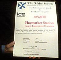[See news item!] Work to improve Haymarket station has received an award. The citation reads:<br><br>
<br><br>
The Saltire Society in association with The Institution of Civil Engineers<br><br>
The Saltire Society's Awards for Civil Engineering 2015<br><br>
<br><br>
Award - Haymarket Station - Capacity Improvement Programme<br><br>
<br><br>
The project demonstrated excellent collaborative working on a live and complex site delivered safely without disruption to rail services or passengers. The completed project provides a state of the art transport hub and an excellent improvement to travel in Edinburgh.<br><br>
<br><br>
Network Rail : Client<br><br>
Morgan Sindall : Main Contractor<br><br>
IDP Architects : Architect<br><br>
CH2MHill : Civil & Structural Engineer<br><br>
<br><br>
(Signed by the presidents of the two societies.)<br><br>[John Yellowlees //]