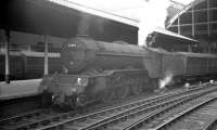 Gresley V2 2-6-2 60963, one of the few examples of the class to be fitted with a double chimney, stands with a train at Newcastle Central in the early 1960s. The locomotive was withdrawn from York in June 1965.<br><br>[K A Gray //]