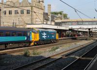 With their enthusiastic following, all the Class 37s used on Cumbrian Coast passenger services could be classed as <I>celebrities</I>. However, 37401 <I>Mary Queen of Scots</I>, in its West Highland livery, is a bit special and made a fine sight in Lancaster on 11th September 2015 with the weekday 1004 Preston to Barrow-in-Furness service.<br><br>[Mark Bartlett 11/09/2015]