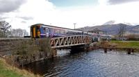The midday service to Mallaig crosses Banavie Swing Bridge over the Caledonian Canal in 2013.<br><br>[Ewan Crawford 27/04/2013]