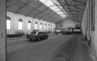 The 3'6' gauge Rothesay Tramway closed in 1936, but the Pointhouse depot survives in commercial use. Looking into the depot with rails in situ.<br><br>[Bill Roberton /10/1996]