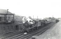 A Glasgow St Enoch - Fairlie Pier boat train runs through Parkhouse Junction on 6 July 1959 with 2P 40688 piloting Standard class 4 76091. Ardrossan shed stands in the background.  <br><br>[G H Robin collection by courtesy of the Mitchell Library, Glasgow 06/07/1959]