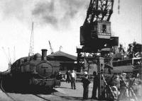 This photograph was taken on a Brownie 127 camera in, I think, 1955. It shows the Channel Islands steamer, the boat train and the Quay station. [See image 48062] for a more recent view of the station.<br><br>[Andrew Saunders //]