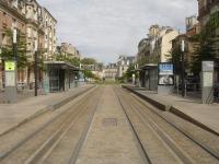 Looking north north west through Langlet tram stop, close to the magnificent Gothic Notre-Dame de Reims Cathedral, on the Reims light rail network. Of note is the lack of overhead catenary, with centre track induction power appearing to be utilised in order to give clear views of the Cathedral. The section of line to rear of view was out of use due to extensive works being carried out at the next, Opera, tram stop.  <br><br>[David Pesterfield 24/07/2015]