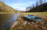 A rowing boat, at the Drygrange beat of the Tweed, with the Leaderfoot viaduct and fishermen's hut in the background.<br><br>[Ewan Crawford 06/03/2016]