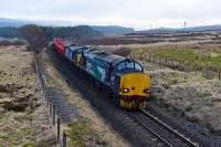 37218 and 37607 work the Mossend Down Yard to Forsinard engineers train. Pictured leaving Tomatin which was the only place in the Inverness area that wasn't foggy today.<br><br>[John Gray 16/03/2016]