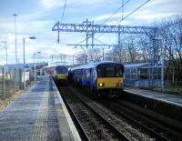 One in, one out. With frequent electric services as well as the hourly through trains to Falkirk Grahamston Cumbernauld station is not the relative backwater it once was. Through services to Edinburgh are planned for 2018 too.<br><br>[David Panton 05/03/2016]