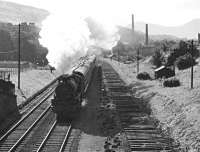 B1 61324 passing Kilnknowe Junction shortly after leaving Galashiels with a Hawick - Edinburgh service in July 1963. Tracklifting is underway on the Peebles branch on the right. [See image 58513]<br><br>[George Kinghorn Collection (Courtesy Bruce McCartney) /07/1963]