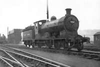 Reid ex-NB class D33 4-4-0 no 62466 in black with new lining at Eastfield in April 1949. Twelve of the class were built at Cowlairs in 1909-10 but were quickly superseded by the D34 'Glen' 4-4-0s. This particular D33 ended its career at Dunfermline in late 1951, with the last example of the class withdrawn by the end of 1953.<br><br>[G H Robin collection by courtesy of the Mitchell Library, Glasgow 09/04/1949]