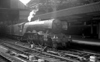 A boat train stands at Newcastle Central on 23 June 1962. A3 60083 <I>Sir Hugo</I> has recently arrived with the 9.40am Kings Cross - Tyne Commission Quay. The Pacific is preparing to hand over to a V1/V3 2-6-2T for the final short leg of the journey. [See image 35716]<br><br>[K A Gray 23/06/1962]