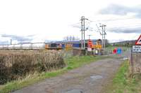 GBRf 66737 passes over Geilston Level Crossing, just west of Cardross.<br><br>[Ewan Crawford 08/04/2016]
