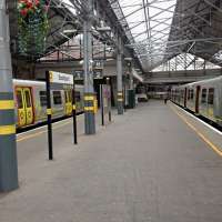 Two gray livery Merseyrail trains at Southport platforms 1 and 2.<br><br>[Veronica Clibbery /04/2016]