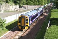 The 0911 Edinburgh - Tweedbank passing the site of Glenesk Colliery in bright morning sunshine on 22 May 2016. The train has recently crossed Glenesk Viaduct, the deck of which can be seen in the background. [See image 50584]<br><br>[John Furnevel 22/05/2016]