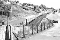An Aberdeen bound train heading east from Dundee in the summer of 1981 approaching the site of the former Stannergate station. Photographed from the (since closed) road bridge from the A92 running into the old dock estate. The notice didn't seem to apply any longer - either that or several local dog walkers were in dead shtook.<br><br>[John Furnevel 11/08/1981]