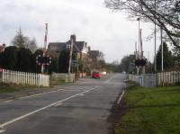 Looking south across Princess Road level crossing, the middle of three within the village of Strensall east of York. York Road level crossing is a short distance to the west, whilst that on Lords Moor Lane, by the former station site, is a greater distance east.<br><br>[David Pesterfield 03/04/2016]
