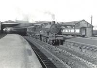 A train from Winton Pier calls at Ardrossan town on 6 July 1959 with a service for Kilmarnock. The locomotive is Hurlford shed's 2P 4-4-0 no 40689.  <br><br>[G H Robin collection by courtesy of the Mitchell Library, Glasgow 06/07/1959]